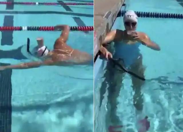 Olympic gold medalist Katie Ledecky swims while balancing glass of Milk on head